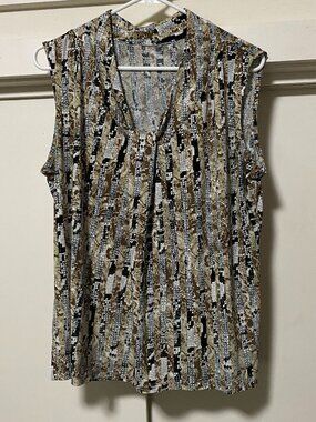 Beautiful sleeveless, multi-design blouse in just as many colors, size L/XL